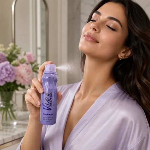 Young Woman Spraying VitaBella Sicilia Deodorant on Neck in Bathroom