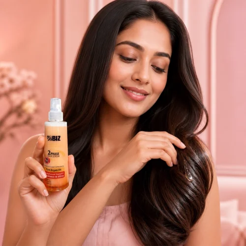 Smiling Woman with Long Dark Hair Holding BIZ 2Phase Hair Serum Bottle