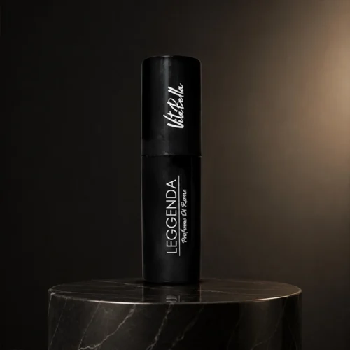 عطر جیبی مشکی لجندا ویکتوریا بلا روی پایه مرمری تیره